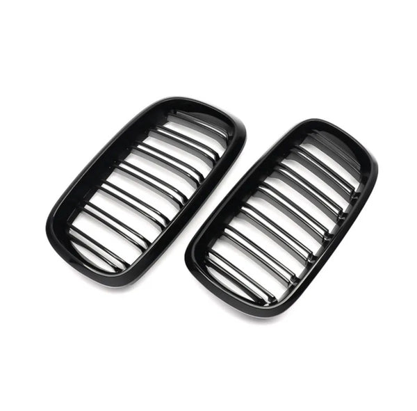 Two black automotive grille inserts, featuring horizontal bars, are placed against a plain white background, likely intended for a car's front end.