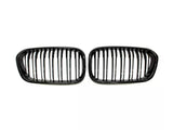 Two black car grilles with vertical slats are positioned side by side on a white background, suggesting they are replacement parts for specific vehicle models.