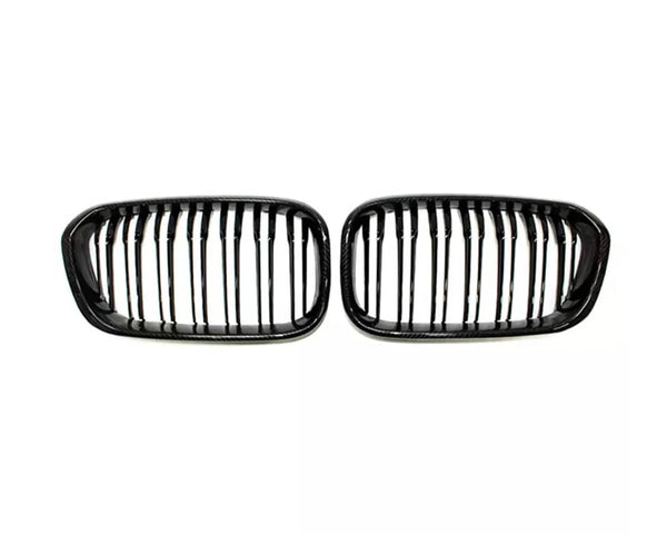 Two black car grilles with vertical slats are positioned side by side on a white background, suggesting they are replacement parts for specific vehicle models.
