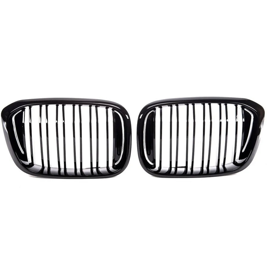 Two black car grilles with vertical slats, aligned side by side against a white background, commonly used as front-end design elements for vehicle air intake and styling.