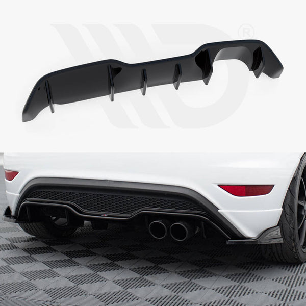 Black car diffuser resting on a white background; the lower section shows it installed on a white car's rear, with dual exhausts and a black rear bumper, on a checkered surface.