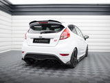 A white Ford hatchback with 