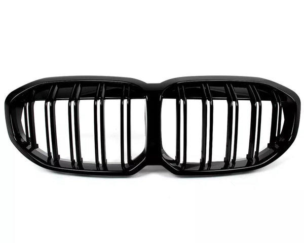 Black car grille with vertical slats, designed in a double kidney shape, isolated on a white background.