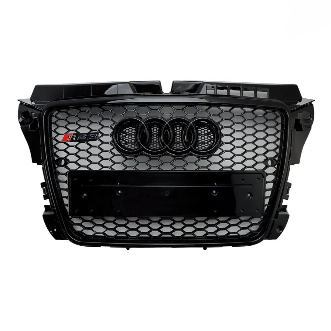 Car grille with a black honeycomb pattern featuring four interlocking rings logo and "RS 5" badge on the side, designed for a vehicle's front-end.