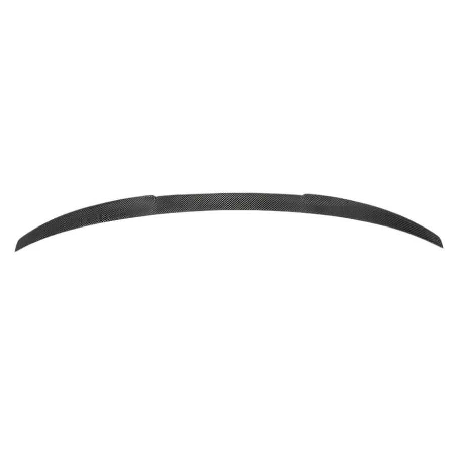 Curved, slender carbon fiber car spoiler resting against a white background, showcasing its streamlined design for aerodynamic enhancement.