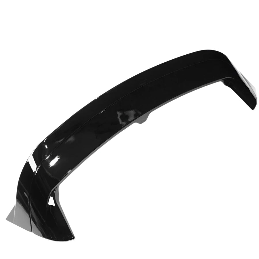 A glossy black car spoiler is shown on a plain white background, highlighting its aerodynamic curve and smooth surface.