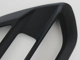 A black, angular car accessory with two rectangular openings is displayed on a plain white background.