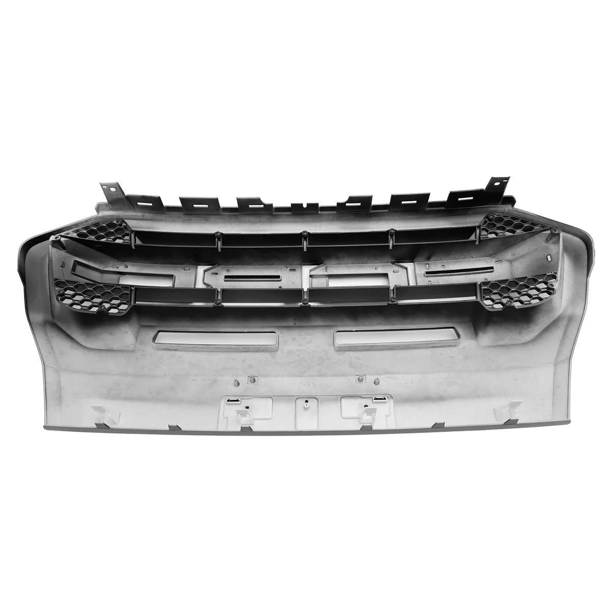 Car bumper with black honeycomb inserts and mounting brackets, displayed against a plain white background.