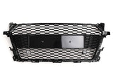A black honeycomb-patterned car grille is displayed on a white background. It features a central rectangular area for a license plate or emblem.