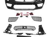 Assorted black car bumper parts, including a large bumper frame and multiple grilles, lay arranged on a white surface, showcasing components typically used in vehicle front-end assembly.