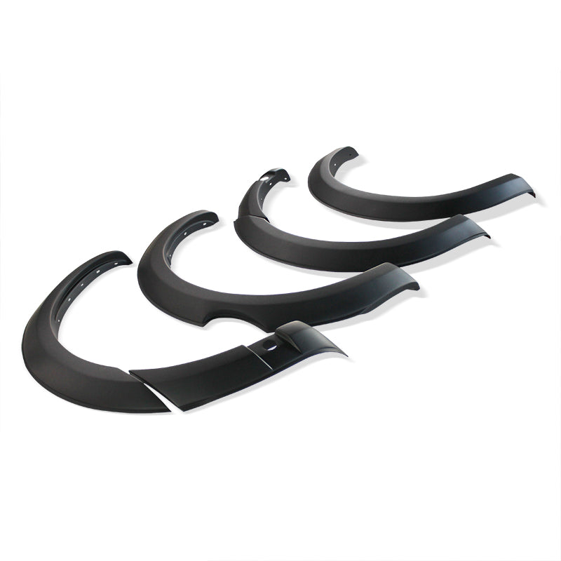Four black fender flares are arranged in a row, showcasing their curved and contoured design, on a plain white background.