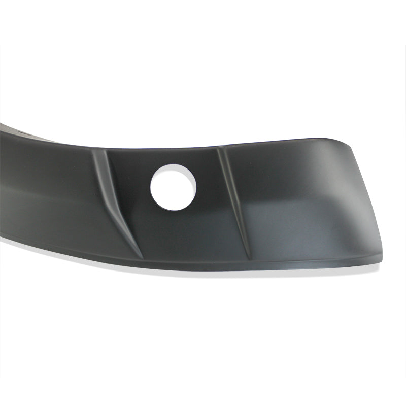 A black curved plastic car bumper cover with a circular hole, featuring angular lines, is set against a plain white background.