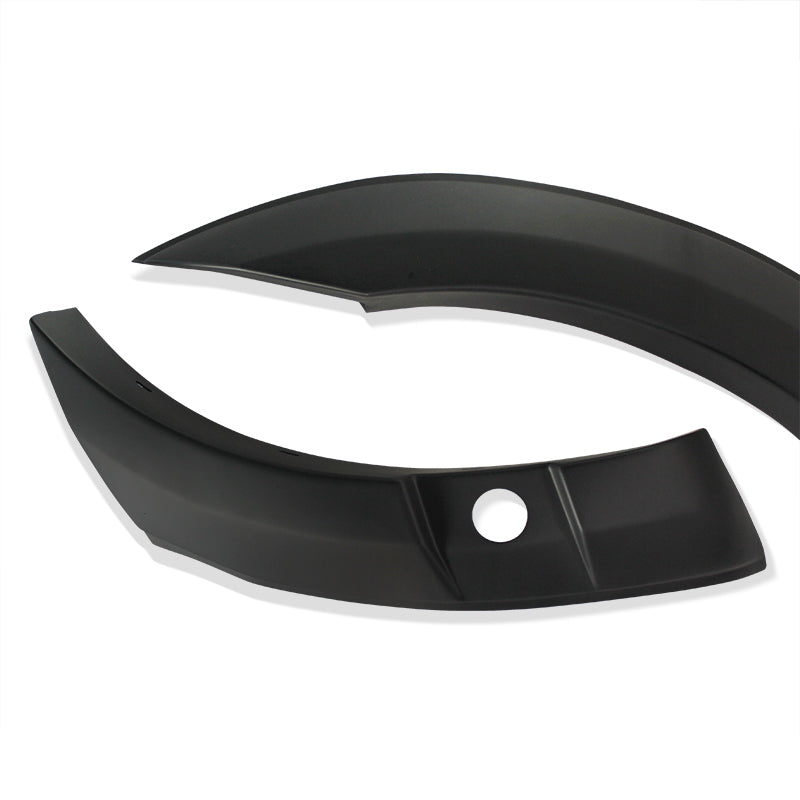 Curved black plastic car trim pieces are positioned on a plain white background, featuring a smooth finish and a circular hole on one piece.