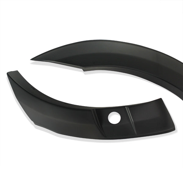 Curved black plastic car trim pieces are positioned on a plain white background, featuring a smooth finish and a circular hole on one piece.