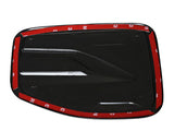 A black, rectangular car accessory with aerodynamic grooves and adhesive backing, featuring red 3M tape along the edges.