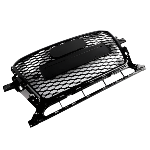 A black honeycomb car grille rests on a white background, featuring an oval emblem space above a rectangular mounting bracket, with supporting frame edges visible.