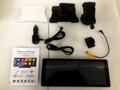 A collection of car accessories including a touchscreen, mounts, power adapter, and cables, arranged on a white foam surface. Includes manual: "Portable Car MP5 Player, Wireless CarPlay & Android Auto, Model: B5303", showing app icons.