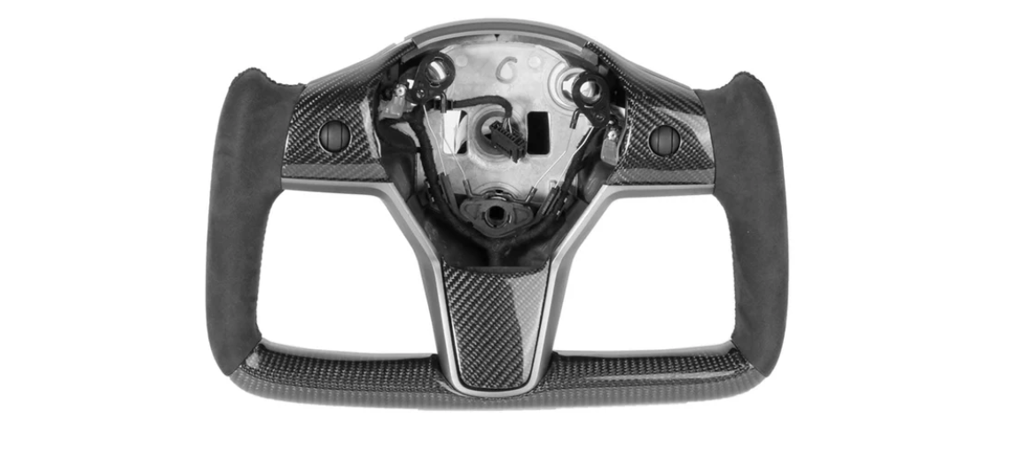 A carbon-fiber steering wheel frame, without a central panel or buttons, rests on a plain white background, showing sleek ergonomic grips and precise craftsmanship.