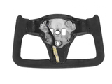 A rectangular black steering wheel with a metal center lacks buttons or features, set against a plain, white background.