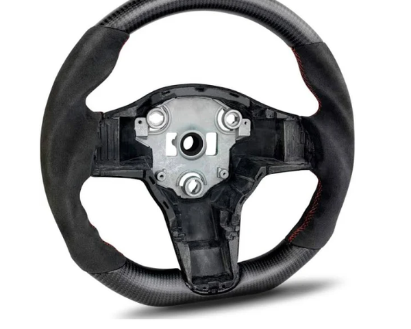 Steering wheel with exposed metal center, featuring carbon fiber texture and black grip, displayed on a white background. The wheel lacks a central horn or control panel.
