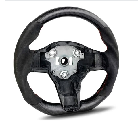 Steering wheel with exposed metal center, featuring carbon fiber texture and black grip, displayed on a white background. The wheel lacks a central horn or control panel.