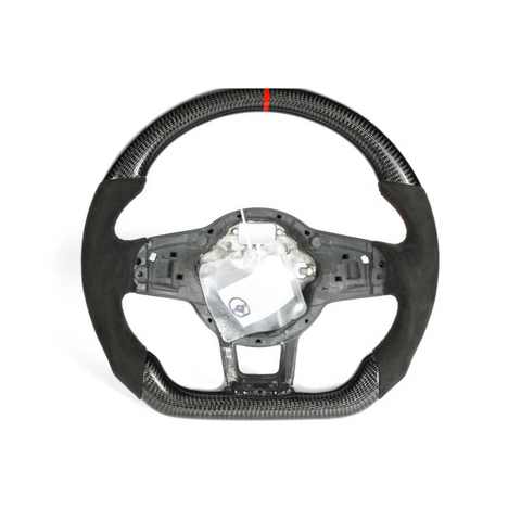 A carbon-fiber steering wheel with a red stripe at the top and a partially exposed interior mechanism, displayed against a plain white background.