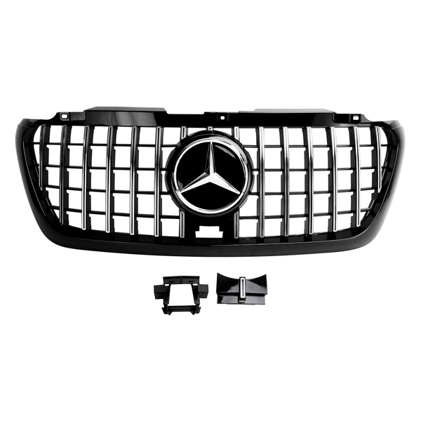 Car grille with a prominent star-shaped emblem centered, featuring a grid pattern. Additional plastic components are placed below, all set against a plain white background.