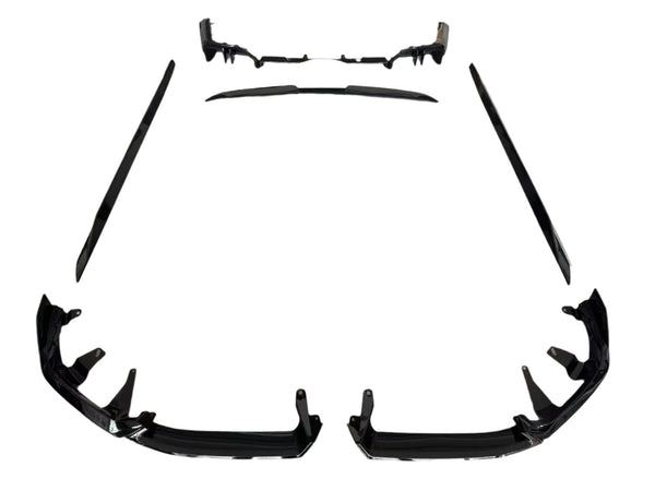 Individual black car body kit components are arranged symmetrically on a white background, including bumper pieces, side skirts, and a rear diffuser, designed for vehicle enhancement and protection.
