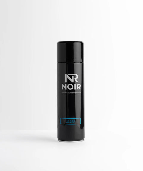 A black aerosol can stands upright on a white surface. It features text reading, "NR NOIR," "High Pressured Deodoriser," and "BLEU" in blue. The background is plain white.