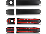 Matte black door handle covers with adhesive strips are aligned horizontally; the bottom covers show red adhesive backing. They're meant for attachment to vehicle doors in an automotive context.
