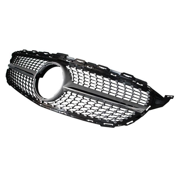 A black car grille features a honeycomb pattern with a circular opening in the center. It is isolated against a plain white background.