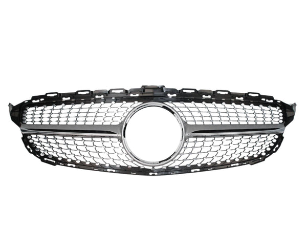 A chrome and black car grille with a honeycomb pattern features a circular emblem space in the center, set against a plain white background.