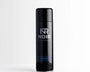 A black cylindrical deodorant can stands upright on a white surface. Text on the can reads "NR NOIR HIGH PRESSURED DEODORISER SAVAGE," set in a minimalistic and bright environment.