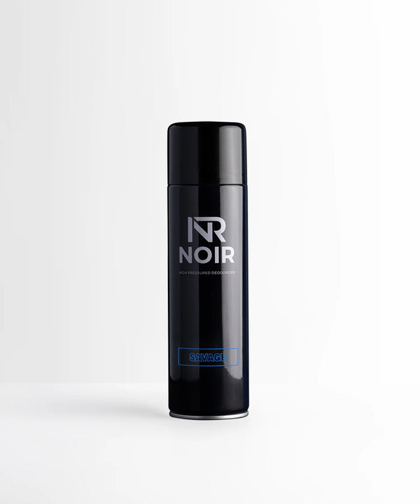 A sleek, dark cylindrical canister labeled "NR NOIR HIGH PRESSURED DEODORISER" and "SAVAGE" stands against a plain white background.