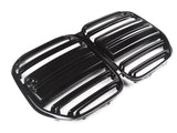 Black, glossy car grille displaying horizontal slats is placed on a plain, white background, suggesting a focus on automotive design and functionality.