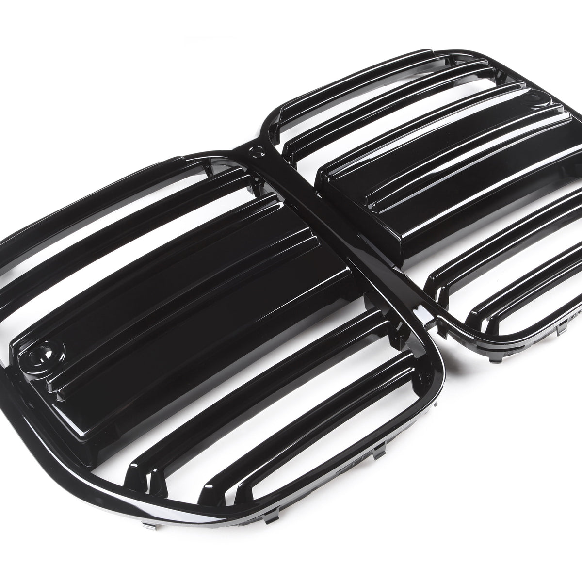 Black, glossy car grille displaying horizontal slats is placed on a plain, white background, suggesting a focus on automotive design and functionality.
