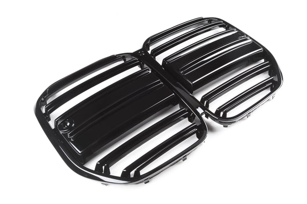Black, glossy car grille displaying horizontal slats is placed on a plain, white background, suggesting a focus on automotive design and functionality.
