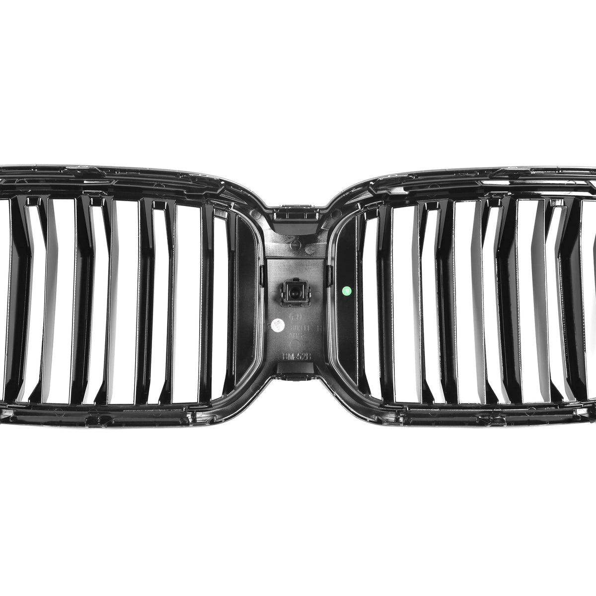 A shiny, black car grille with vertical slats is isolated on a white background. It features a dual-kidney design and has small text and markings visible on the connecting center bar.