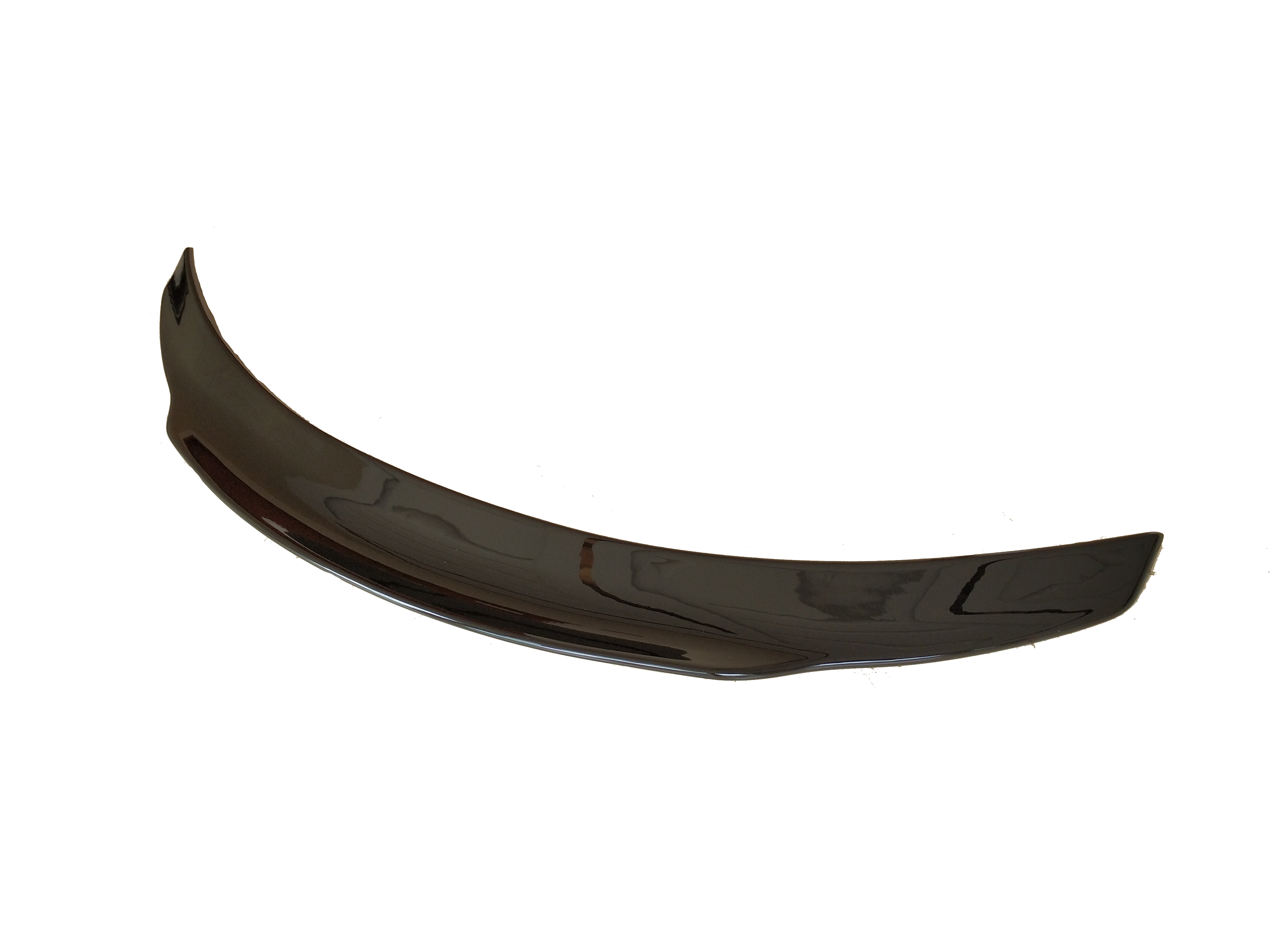 A glossy black car spoiler, curved and sleek, is isolated on a plain white background.