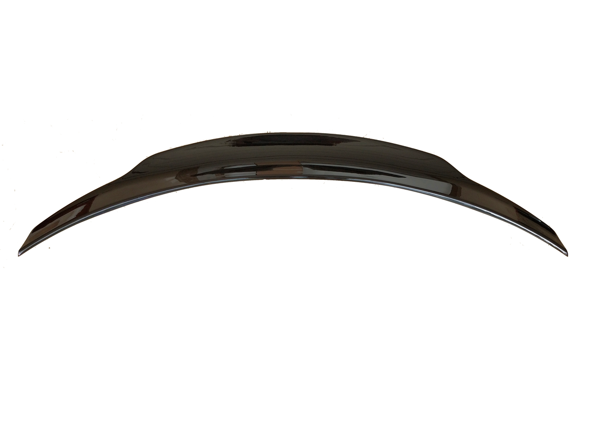 A sleek, curved car spoiler sits isolated on a white background, showcasing its glossy, aerodynamic design, suitable for enhancing a vehicle's performance and style.