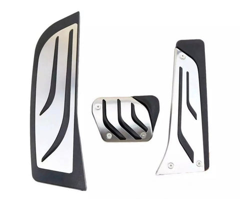 Three metal car pedal covers, featuring sleek black accents and a modern design, are arranged on a plain white background.