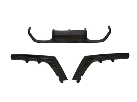 Three black automotive body parts are laid out separately against a white background, comprising a central diffuser and two angled side skirts.