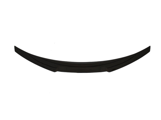 A curved, black car spoiler lies horizontally against a plain white background.
