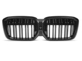 A dual kidney-shaped, black car grille with vertical slats is displayed against a plain white background.