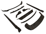 Black automobile body kit components are arranged on a white background. The kit includes various aerodynamic pieces like a front lip and side skirts, designed for vehicle exterior enhancements.