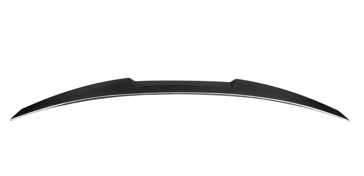 An aerodynamic, black carbon fiber car spoiler sits against a white background, showcasing its sleek, curved design and distinct texture.