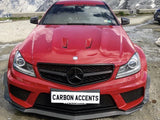 A red Mercedes-Benz car is parked on a mountainous landscape with rocky terrain. The front features 