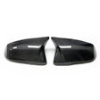 Two glossy carbon fiber car mirror covers, facing each other, are placed on a white background, highlighting their sleek and modern design.