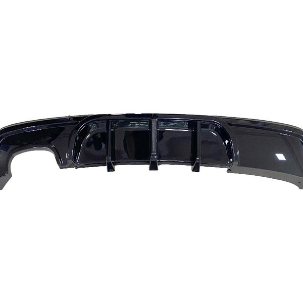 A glossy black car rear diffuser featuring vertical fins is displayed against a plain white background.