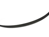 A sleek, curved black carbon fiber spoiler blade rests on a white background, showcasing a finely textured surface with diagonal patterns, designed to enhance vehicle aerodynamics.